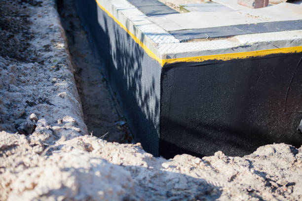 Professional Waterproofing technician working in Williamsport, TN